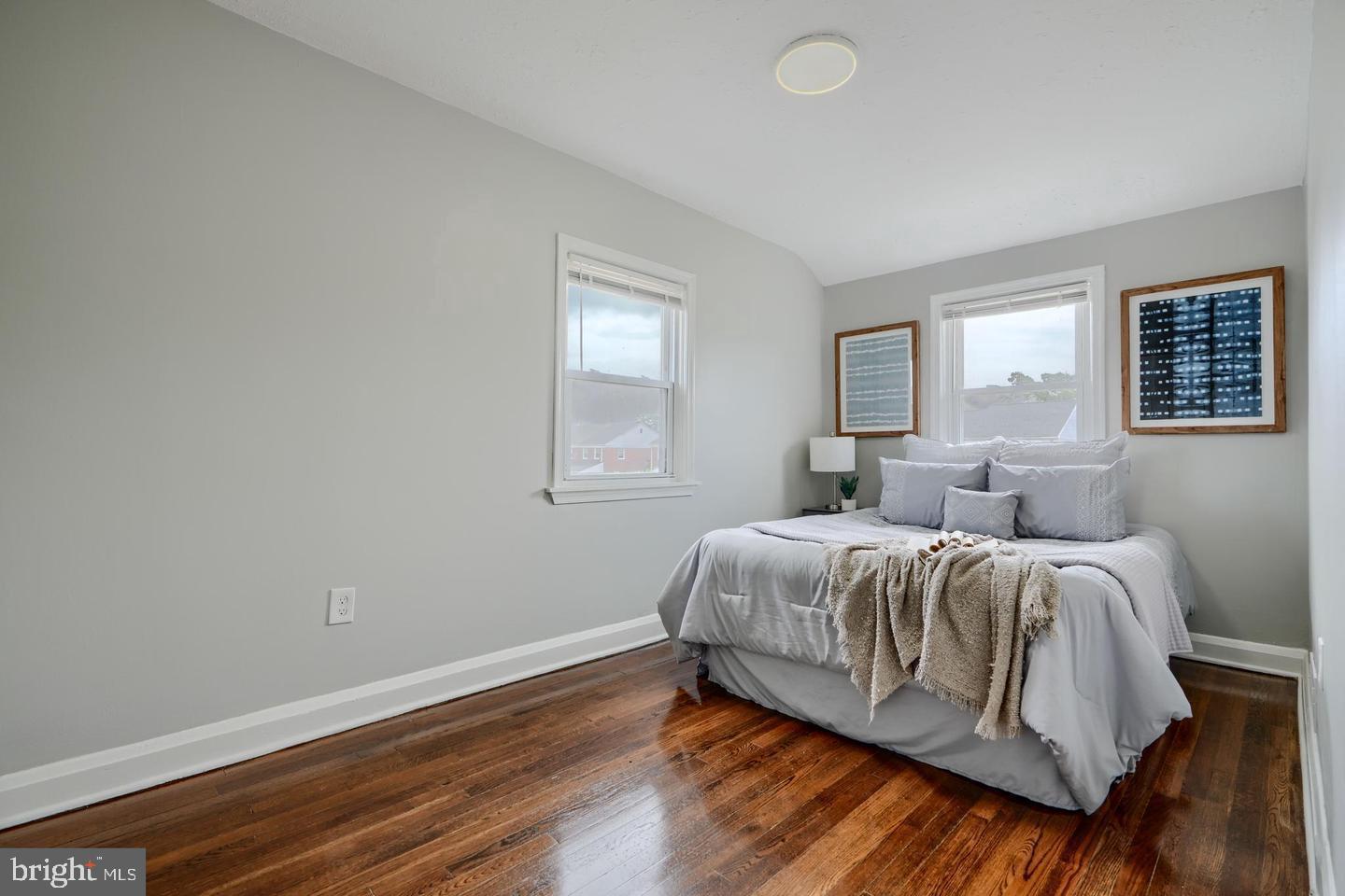1944 Quentin Road Dundalk, MD 21222 - Photo 22 of 41 a spacious bedroom with a bed and window