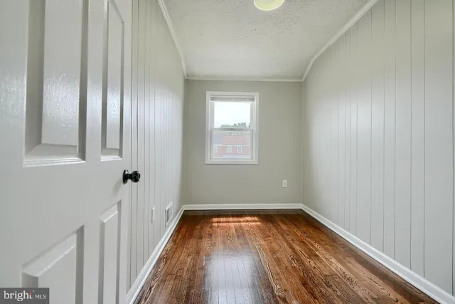 a view of a room with wooden floor and staircase