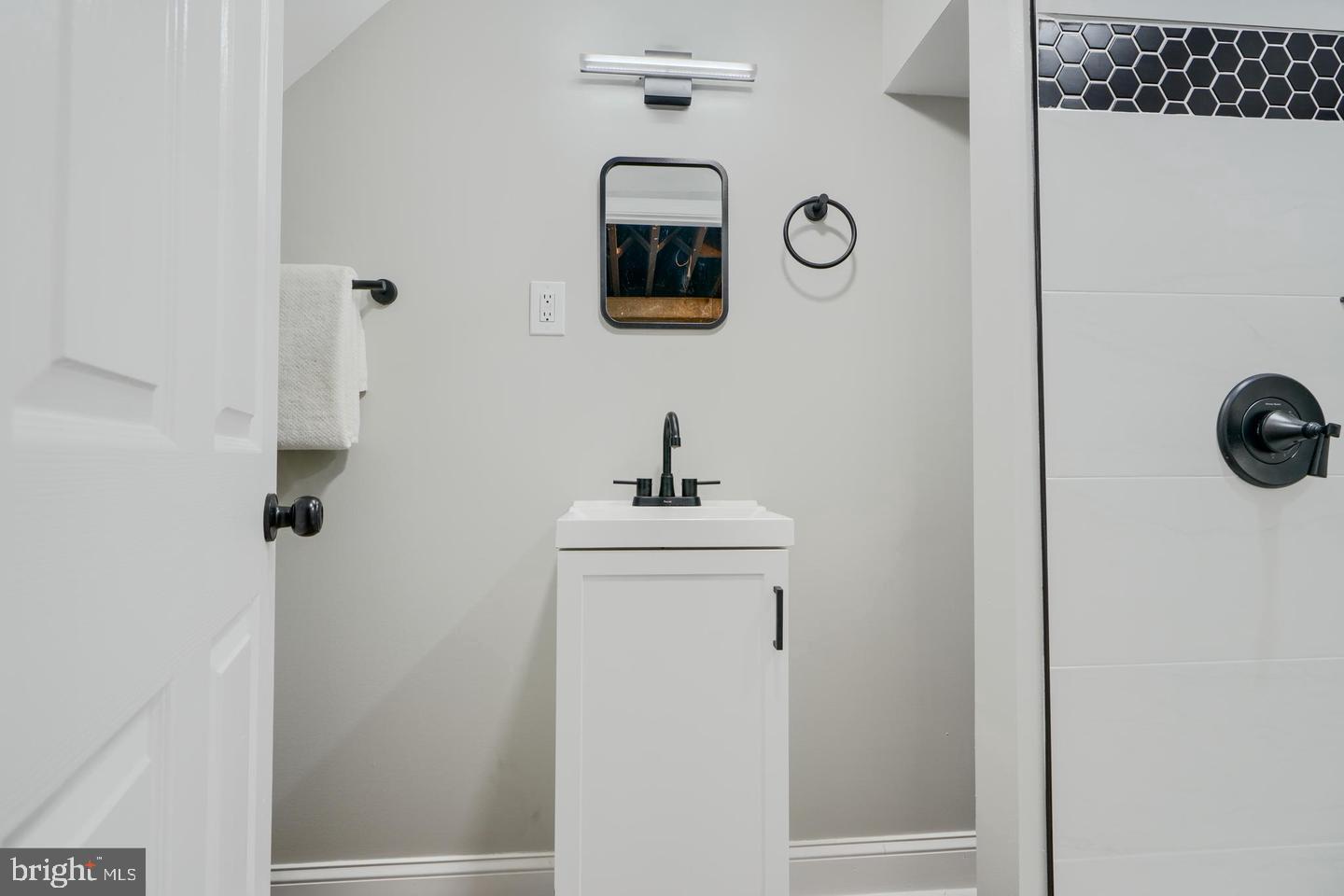 1944 Quentin Road Dundalk, MD 21222 - Photo 30 of 41 a bathroom with a sink and a mirror