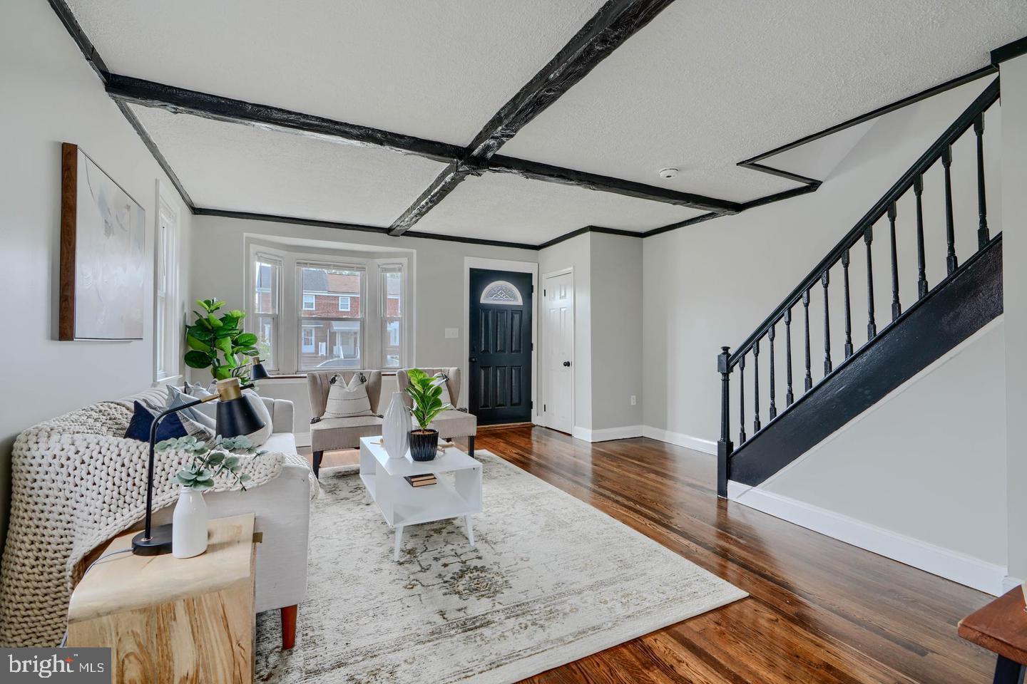 1944 Quentin Road Dundalk, MD 21222 - Photo 3 of 41 a living room with furniture wooden floor and a chandelier