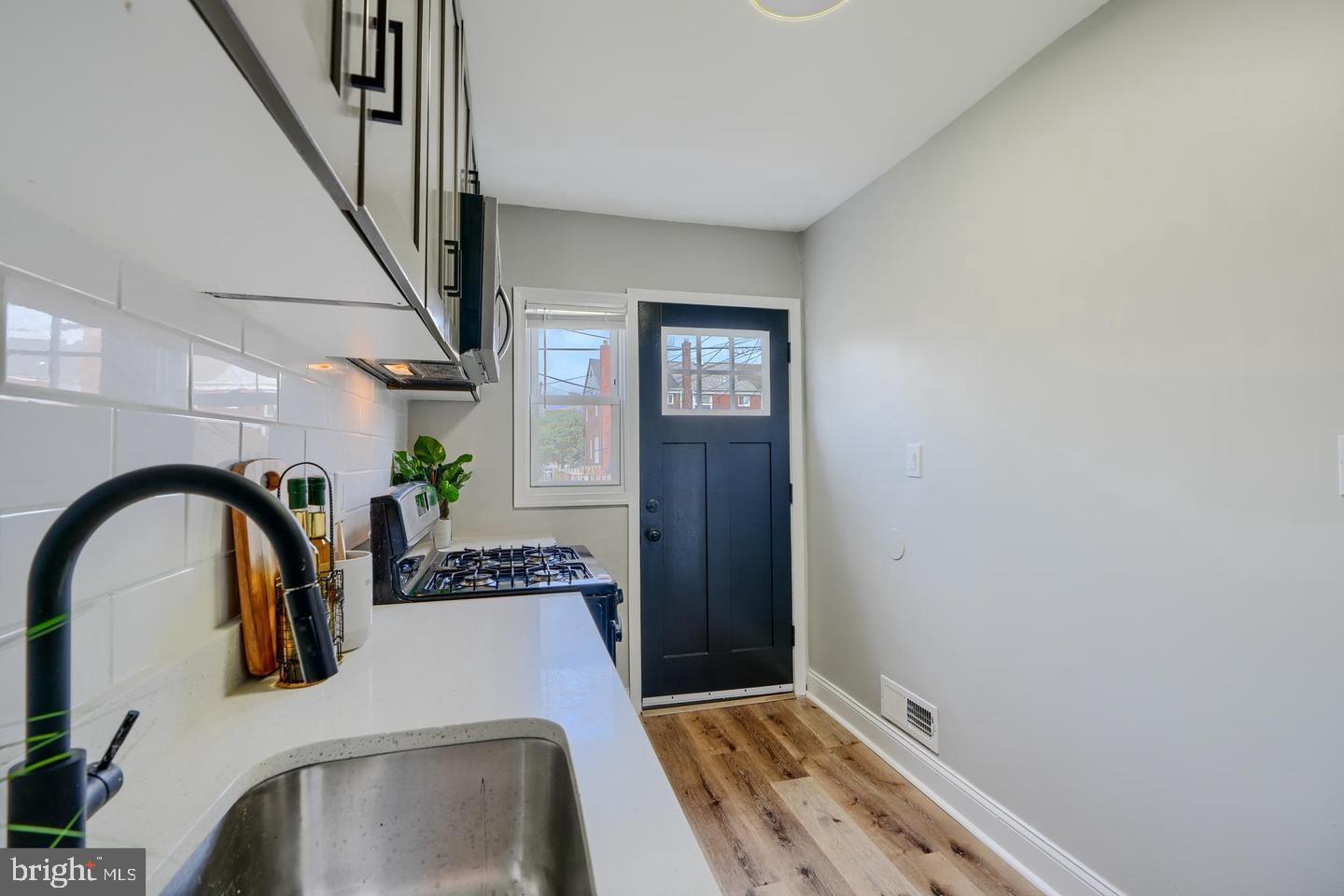 1944 Quentin Road Dundalk, MD 21222 - Photo 9 of 41 a bathroom with a sink and a mirror