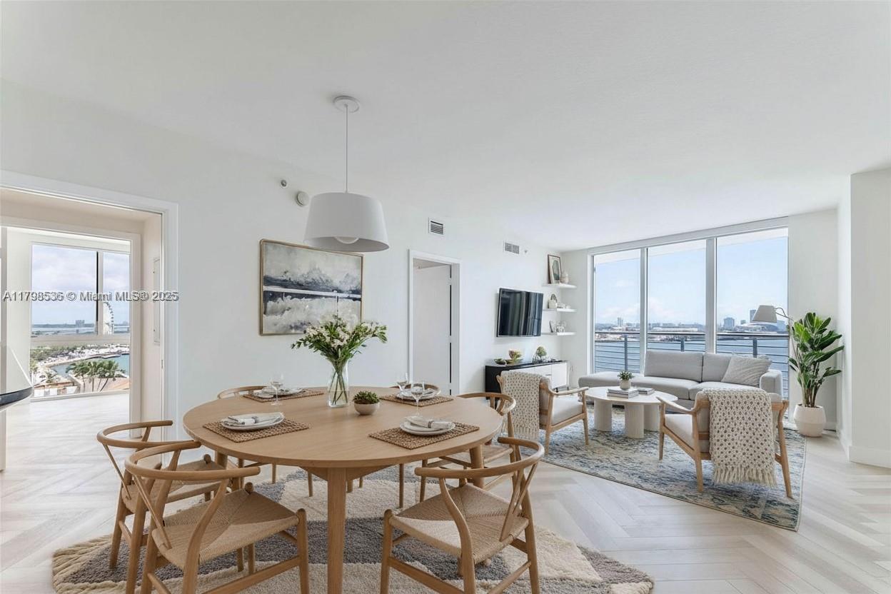a view of a dining room with furniture window and outside view