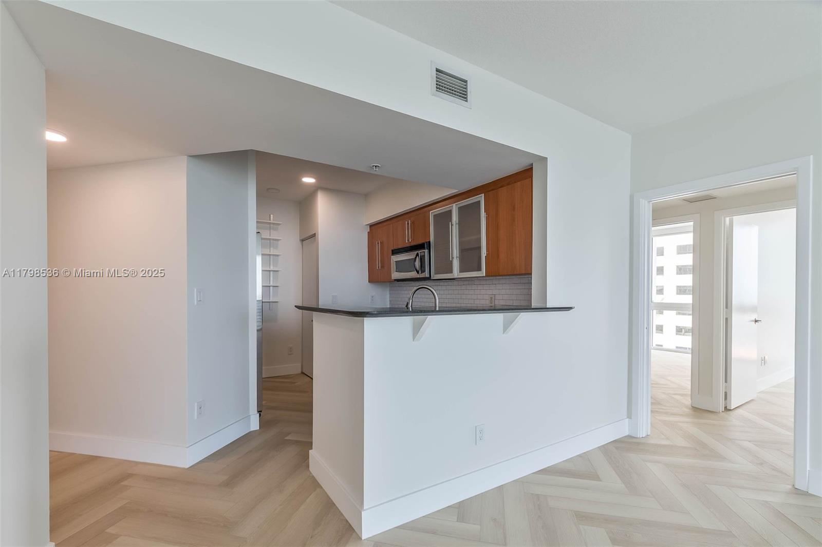 335 South Biscayne Boulevard, Unit 1012 Miami, FL 33131 - Photo 7 of 14 a view of a hallway with some storage