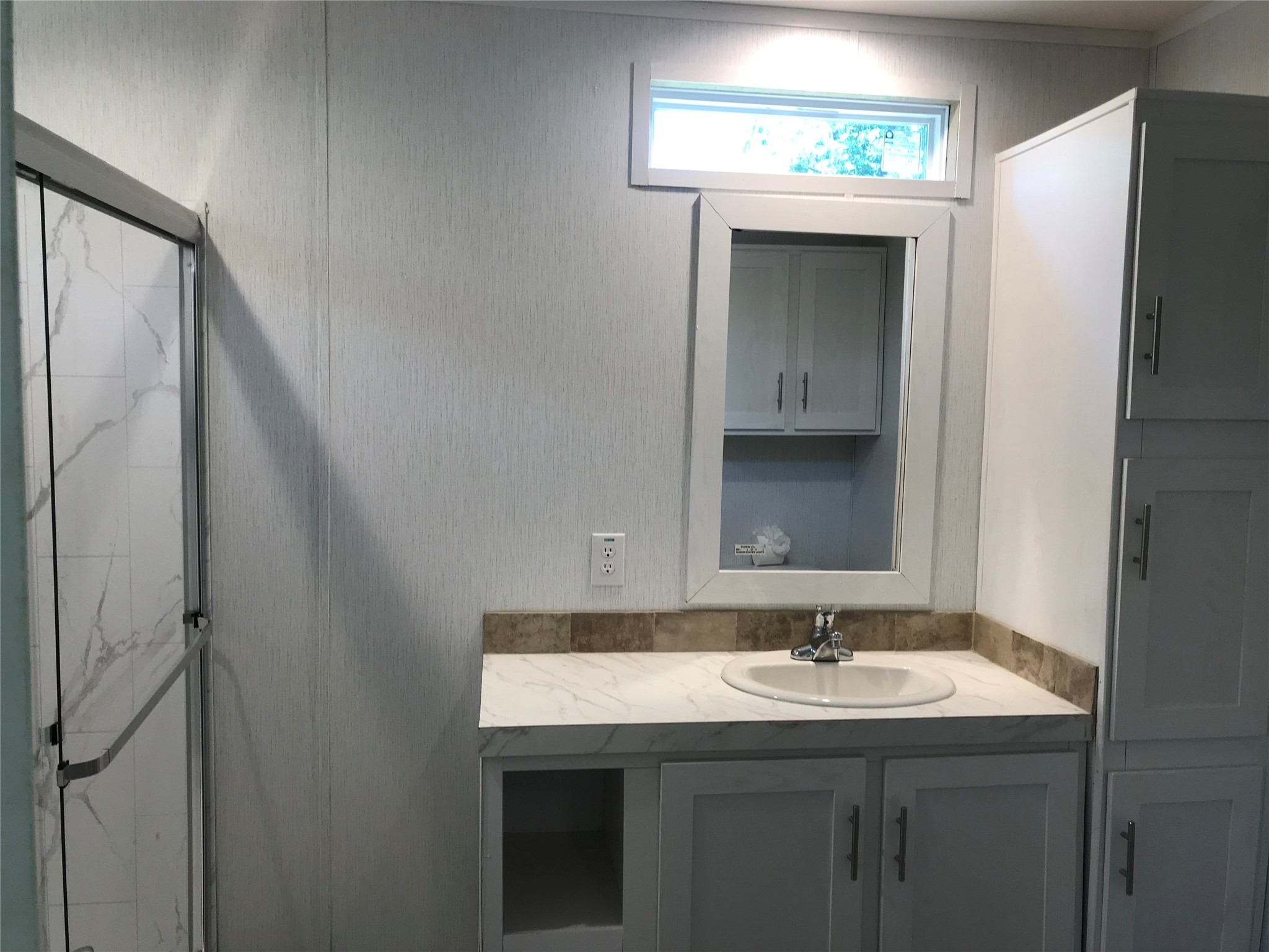 246 Brenda Road Trinity, TX 75862 - Photo 14 of 24 a bathroom with a granite countertop sink and a mirror