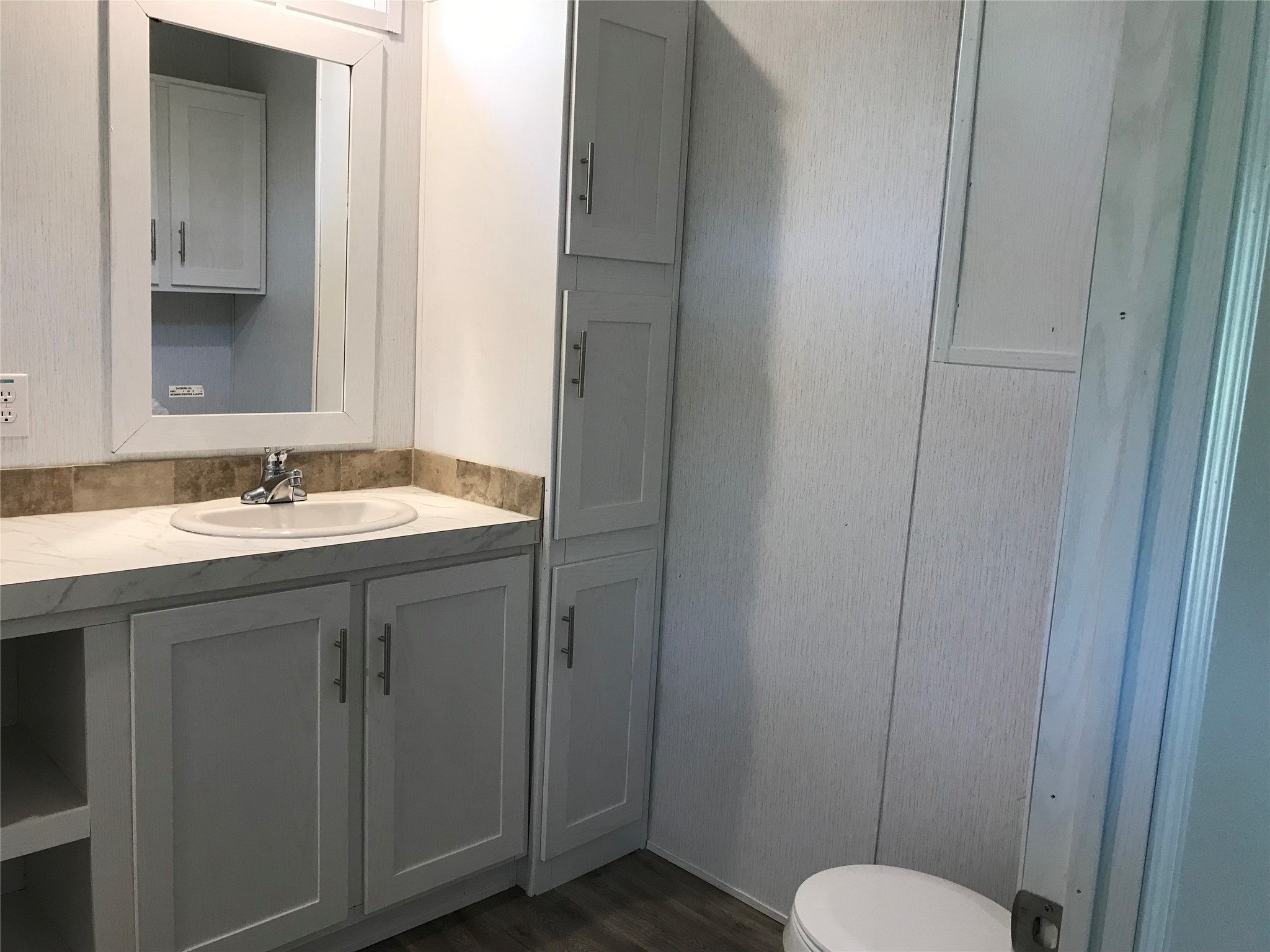 246 Brenda Road Trinity, TX 75862 - Photo 15 of 24 a bathroom with a sink and a mirror