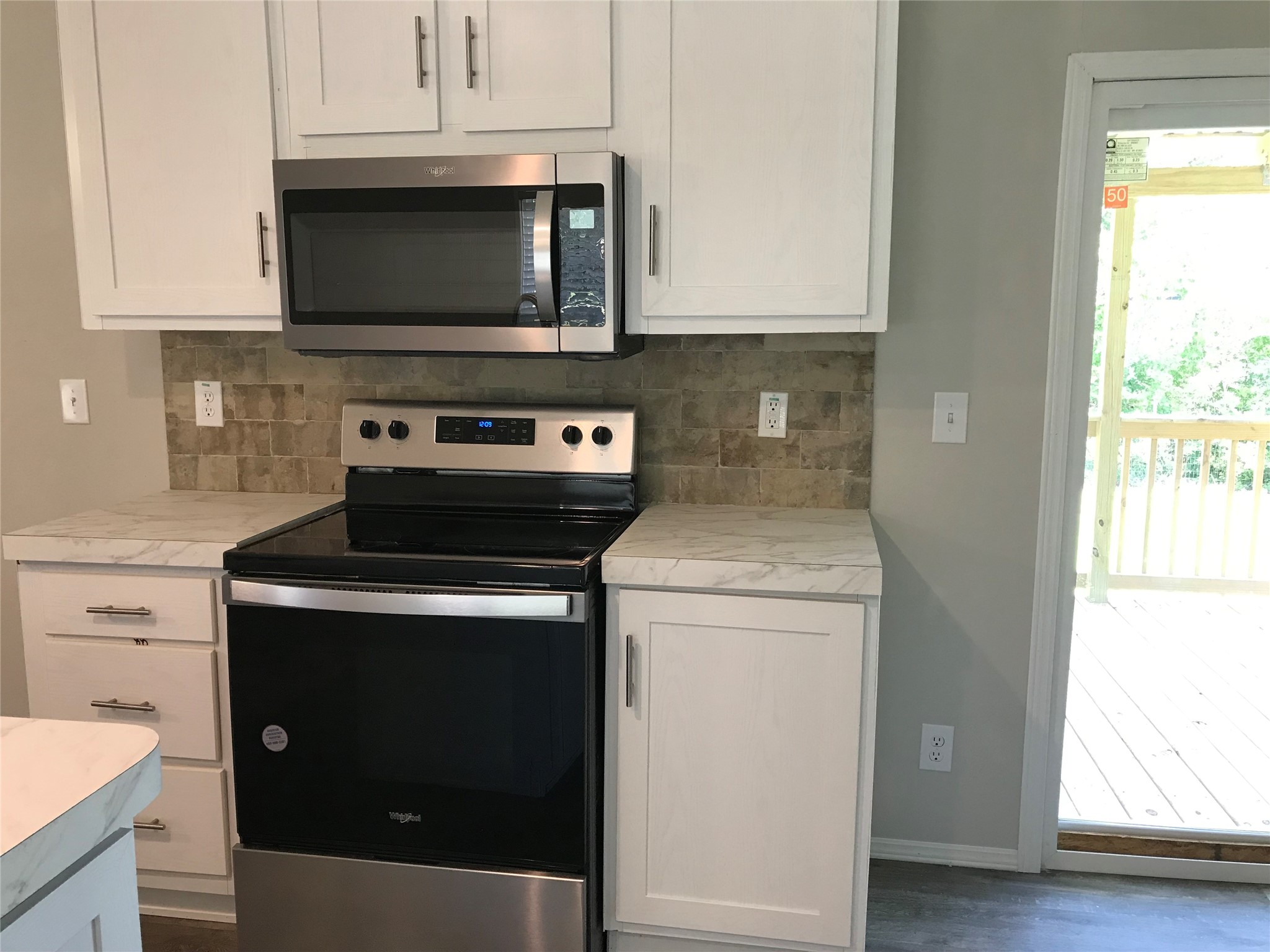 246 Brenda Road Trinity, TX 75862 - Photo 24 of 24 a kitchen with a stove and a microwave