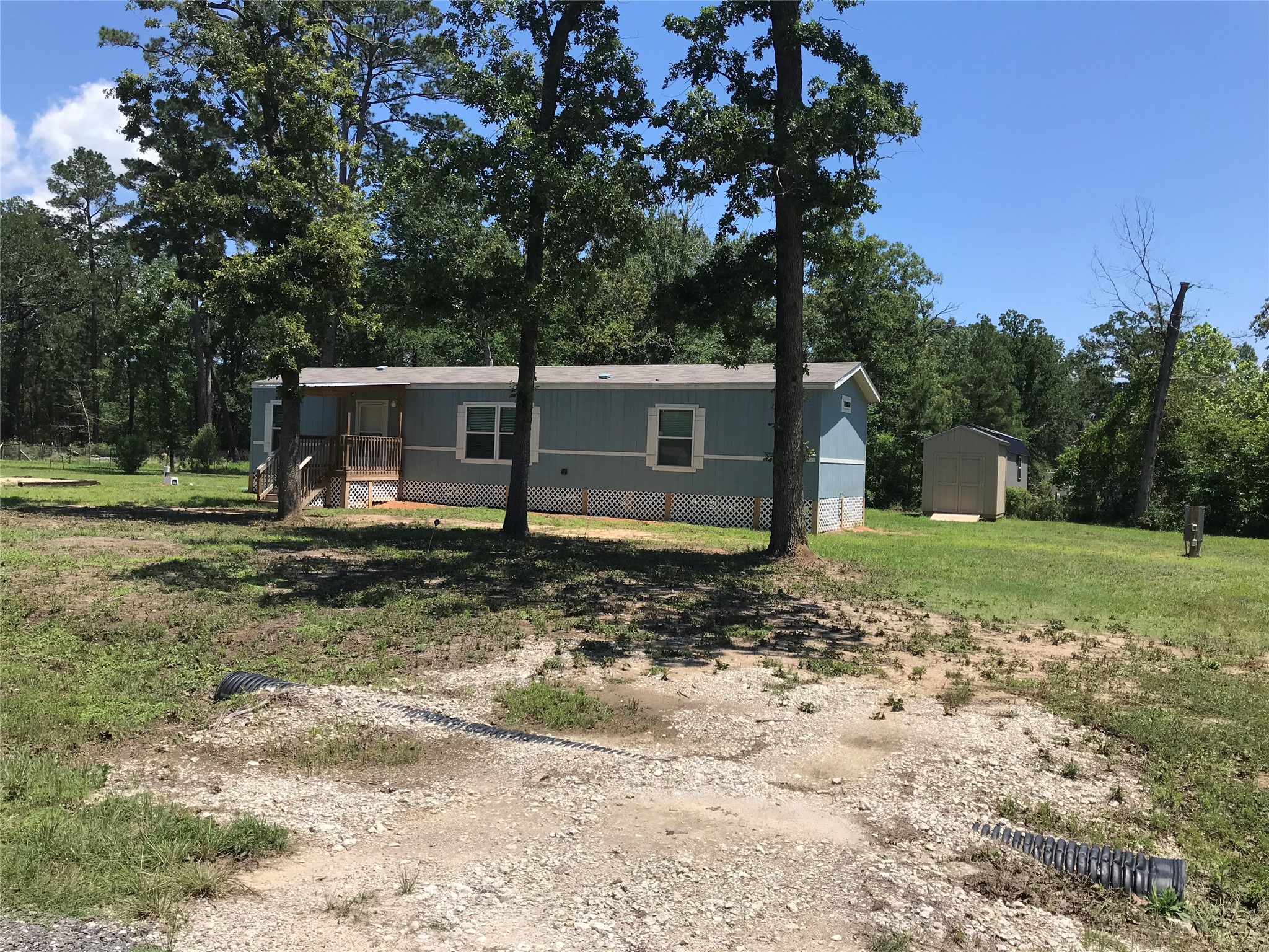 246 Brenda Road Trinity, TX 75862 - Photo 3 of 24 a view of a house with a backyard