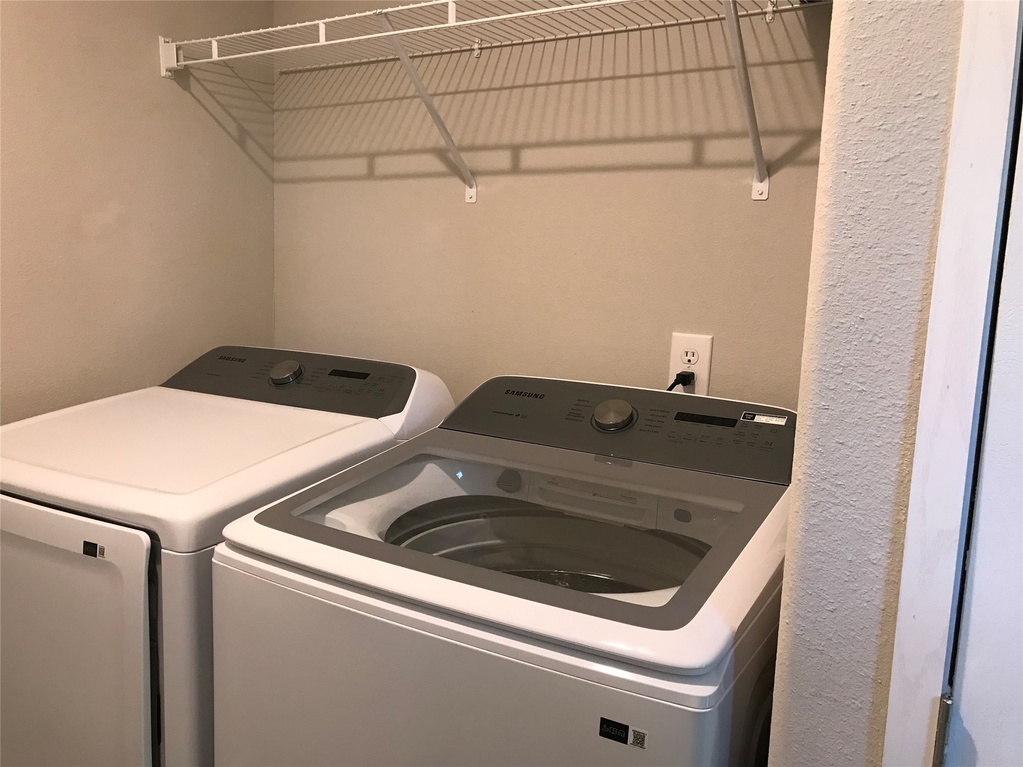 246 Brenda Road Trinity, TX 75862 - Photo 9 of 24 a utility room with dryer and washer