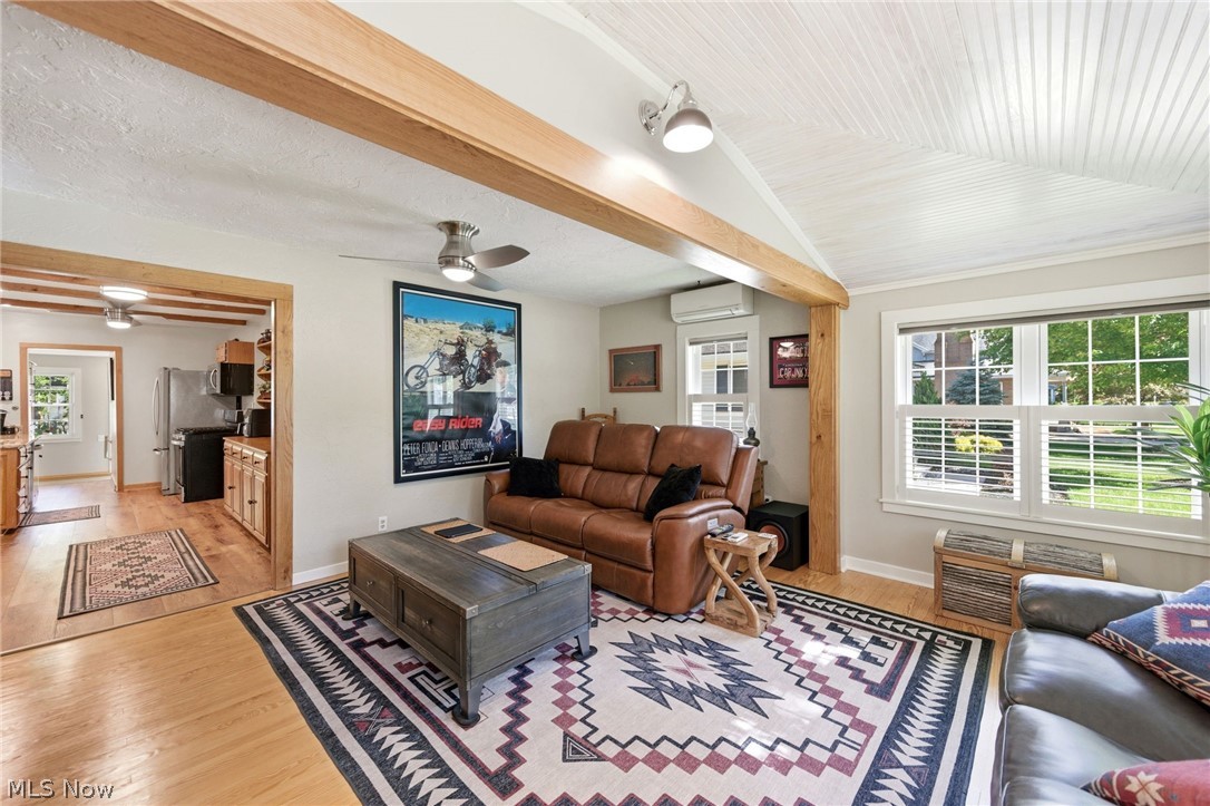233 Sunset Road Avon Lake, OH 44012 - Photo 9 of 50 Vaulted ceiling with white beadboard finish and exposed wood beams