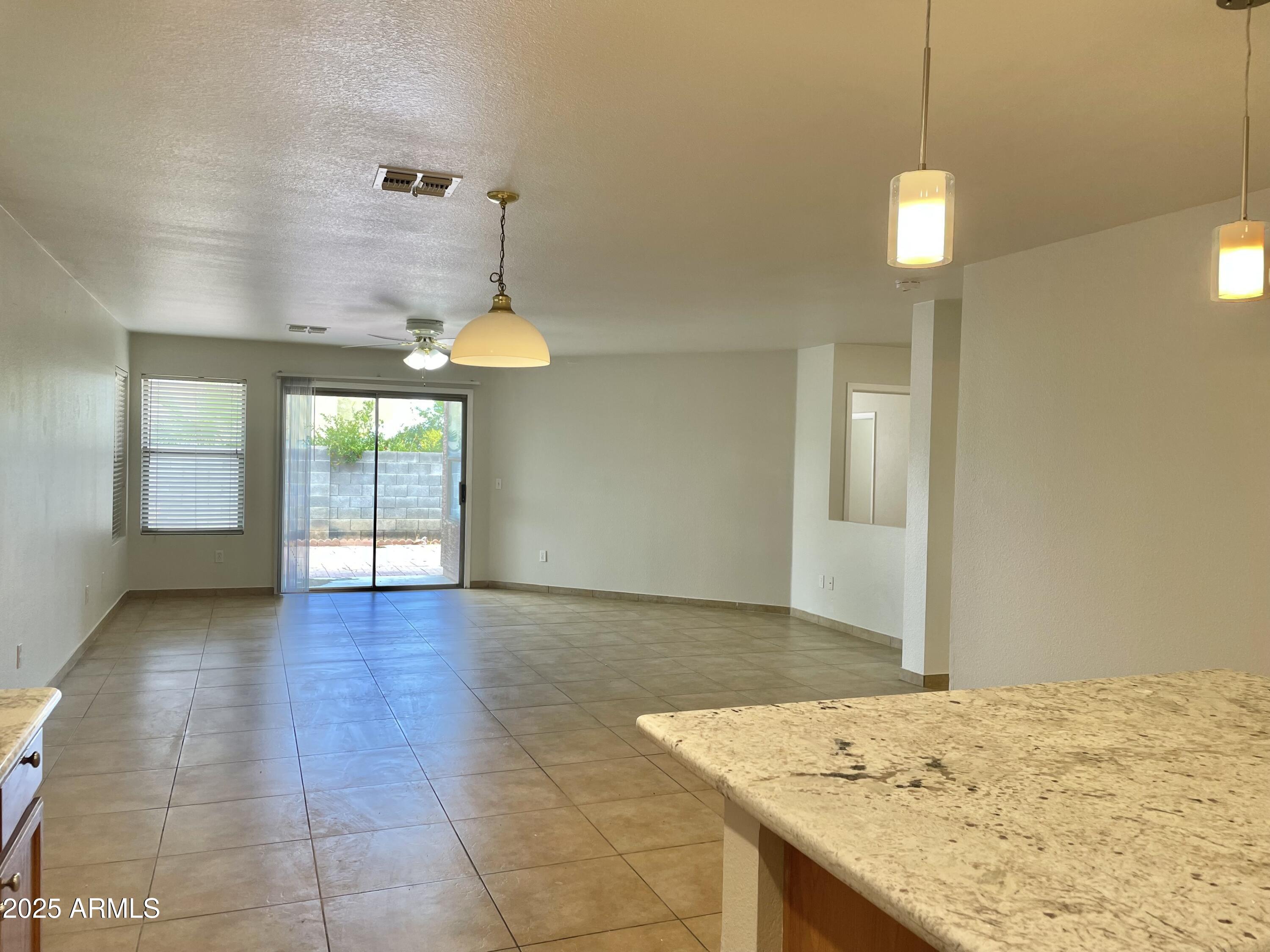 1002 East Arabian Drive Gilbert, AZ 85296 - Photo 11 of 23 a view of a kitchen with a sink and chandelier