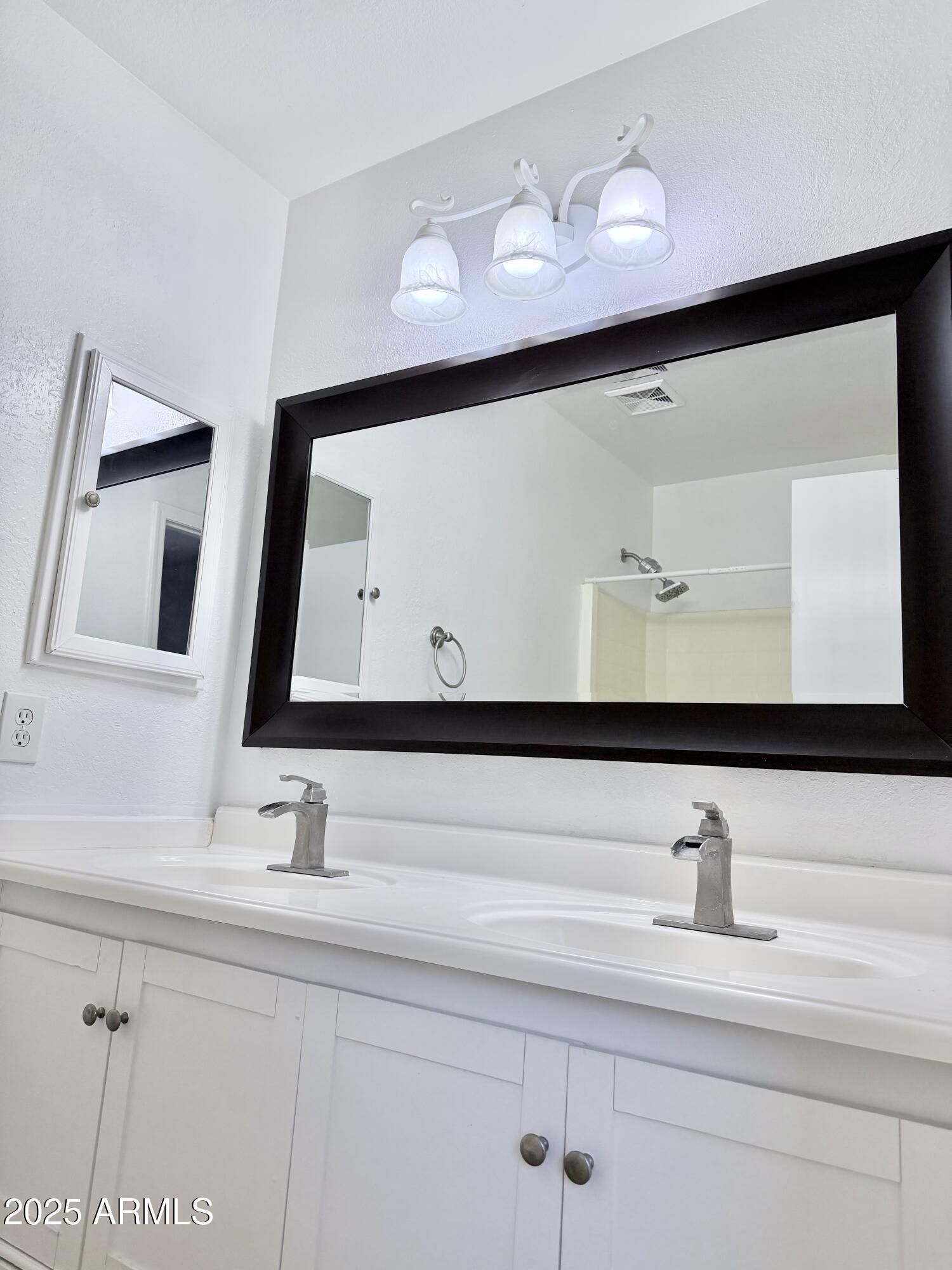 1002 East Arabian Drive Gilbert, AZ 85296 - Photo 15 of 23 a bathroom with a sink mirror and vanity
