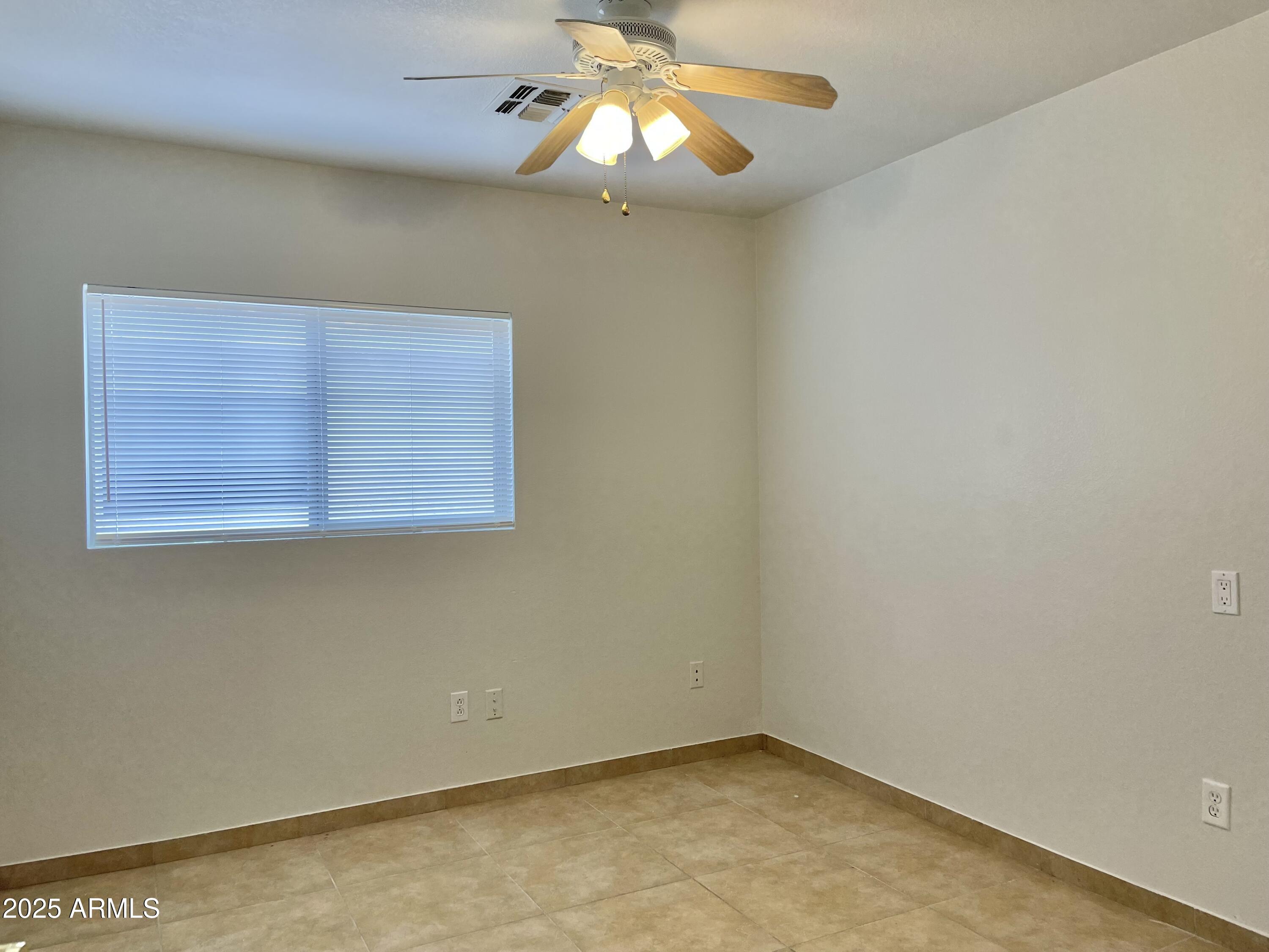 1002 East Arabian Drive Gilbert, AZ 85296 - Photo 18 of 23 an empty room with a window