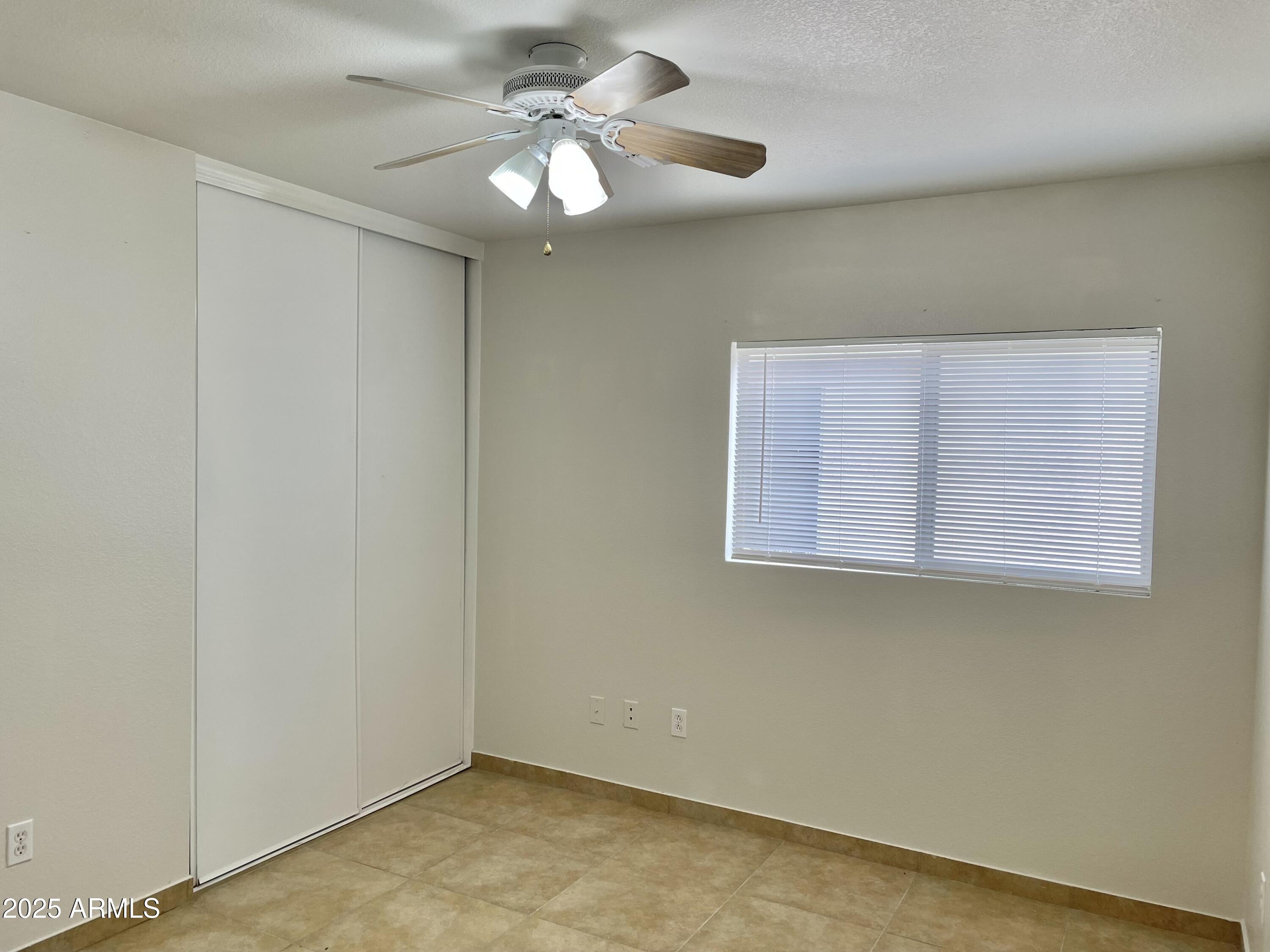 1002 East Arabian Drive Gilbert, AZ 85296 - Photo 19 of 23 an empty room with a window