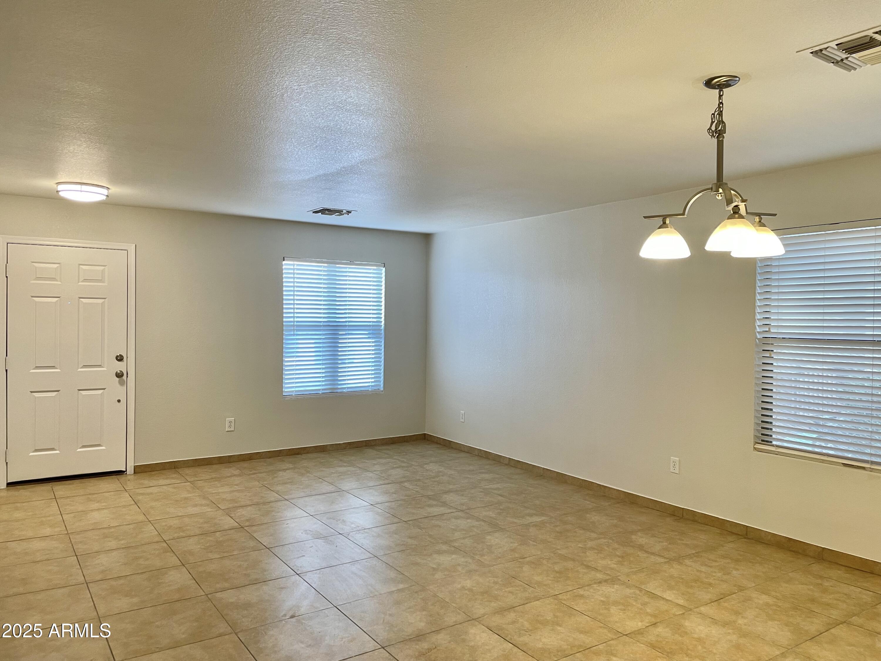 1002 East Arabian Drive Gilbert, AZ 85296 - Photo 5 of 23 a view of empty room with windows