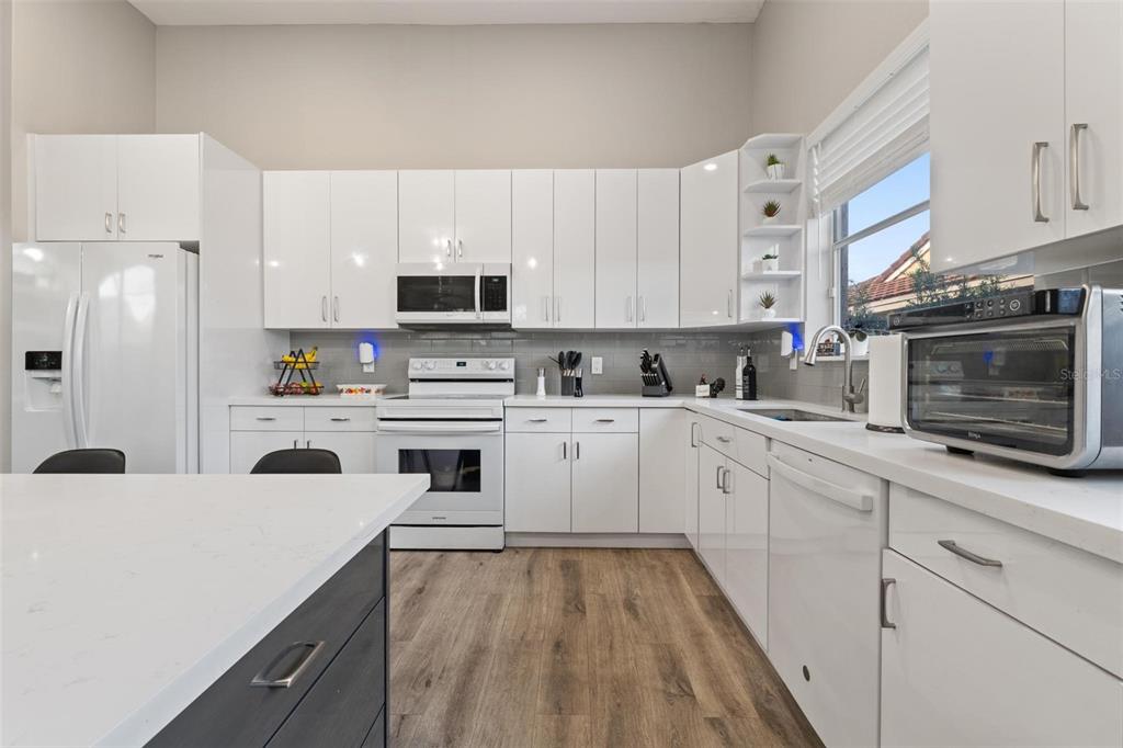 343 Southwest 187th Terrace Pembroke Pines, FL 33029 - Photo 15 of 48 a kitchen with white cabinets and appliances