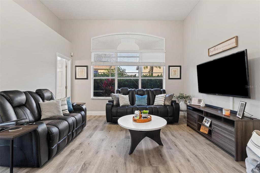 343 Southwest 187th Terrace Pembroke Pines, FL 33029 - Photo 19 of 48 a living room with furniture and a flat screen tv