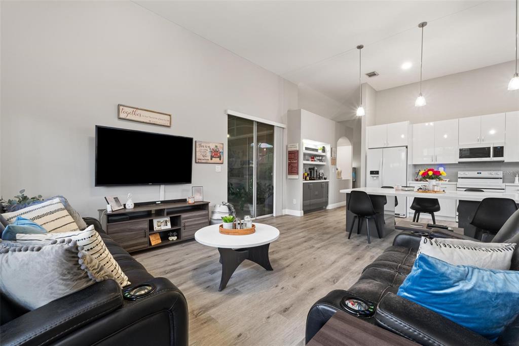343 Southwest 187th Terrace Pembroke Pines, FL 33029 - Photo 20 of 48 a living room with furniture and a flat screen tv