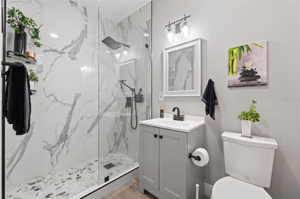 343 Southwest 187th Terrace Pembroke Pines, FL 33029 - Photo 21 of 48 a bathroom with a sink toilet and shower