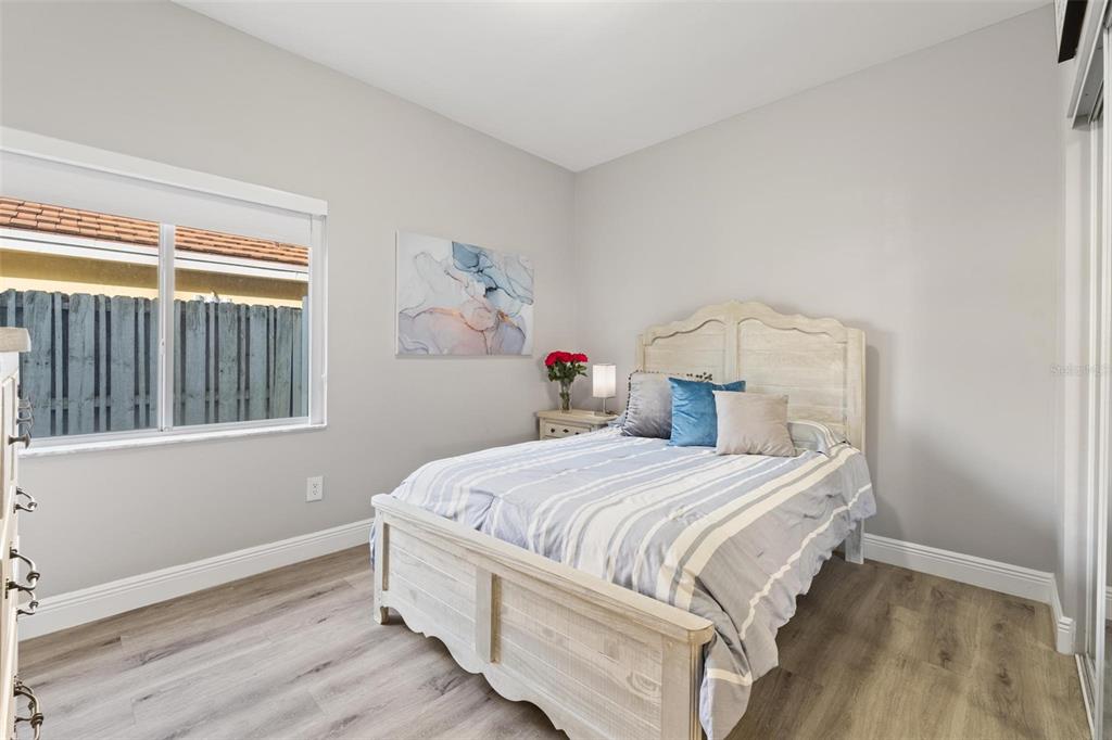343 Southwest 187th Terrace Pembroke Pines, FL 33029 - Photo 32 of 48 a bedroom with a bed and a window