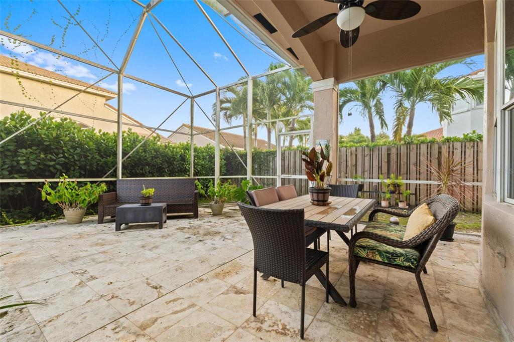343 Southwest 187th Terrace Pembroke Pines, FL 33029 - Photo 38 of 48 a view of a chair and tables in the patio
