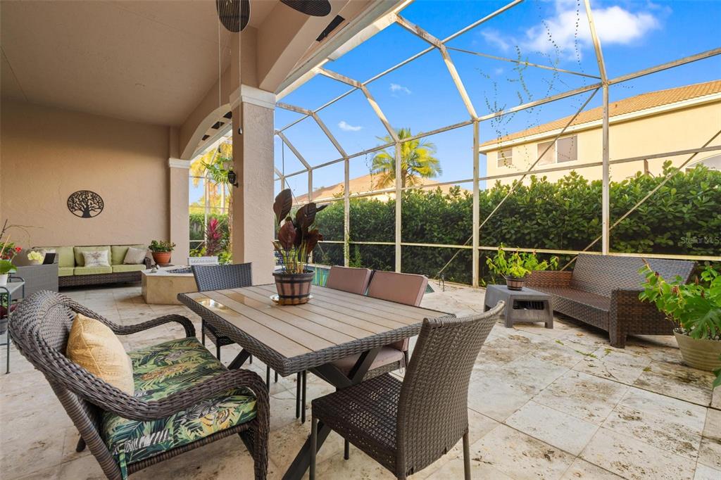 343 Southwest 187th Terrace Pembroke Pines, FL 33029 - Photo 39 of 48 a view of a patio with a dining table and chairs