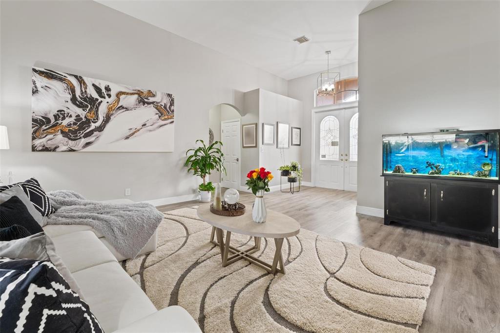 343 Southwest 187th Terrace Pembroke Pines, FL 33029 - Photo 9 of 48 a living room with furniture and a flat screen tv
