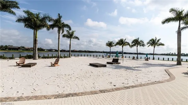a view of swimming pool with a table and chairs
