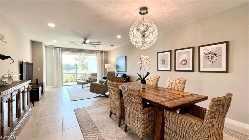 14827 Edgewater Circle Naples, FL 34114 - Photo 11 of 32 a view of a dining room with furniture