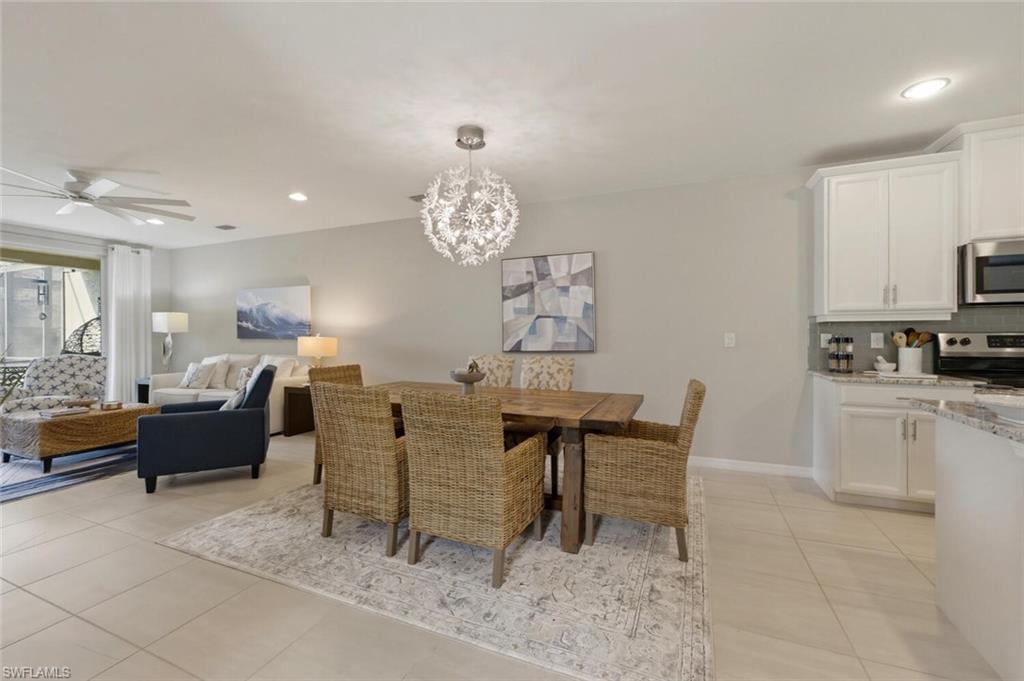 14827 Edgewater Circle Naples, FL 34114 - Photo 11 of 49 a view of a dining room with furniture