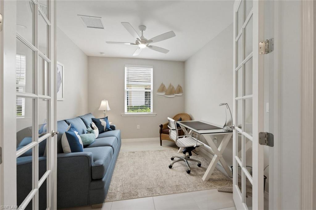 14827 Edgewater Circle Naples, FL 34114 - Photo 20 of 49 a living room with furniture