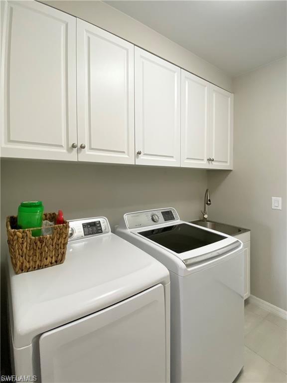 14827 Edgewater Circle Naples, FL 34114 - Photo 20 of 32 a utility room with dryer and washer