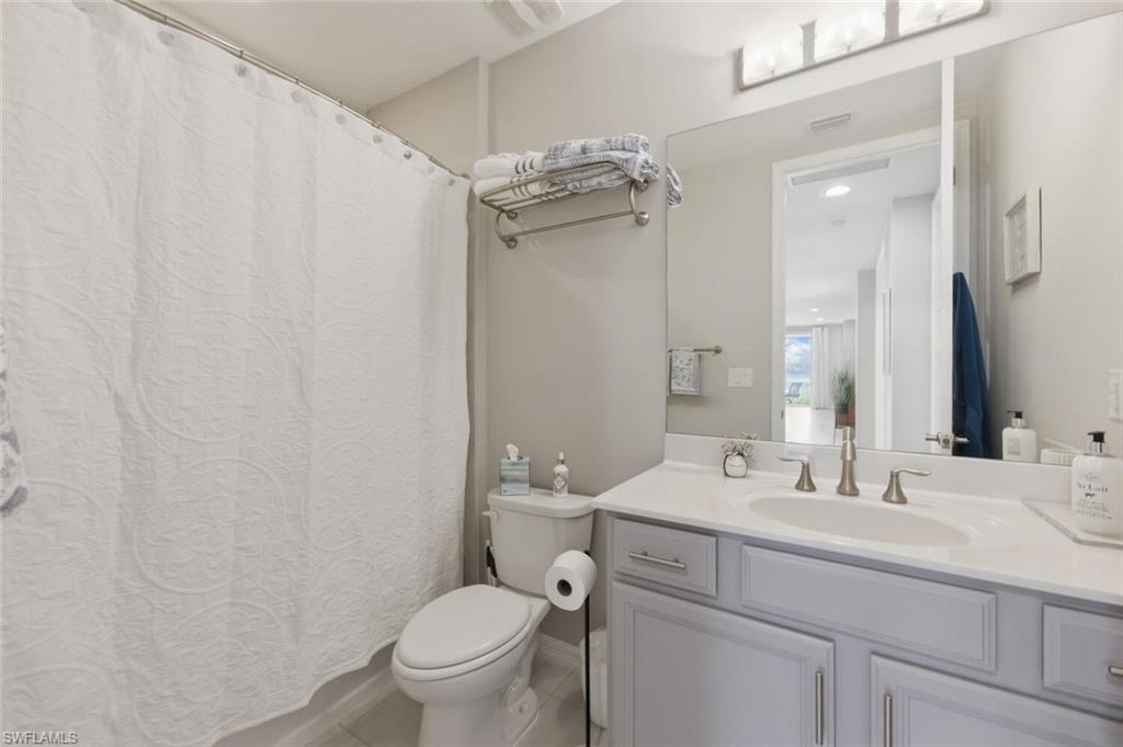 14827 Edgewater Circle Naples, FL 34114 - Photo 27 of 49 a bathroom with a sink toilet and shower
