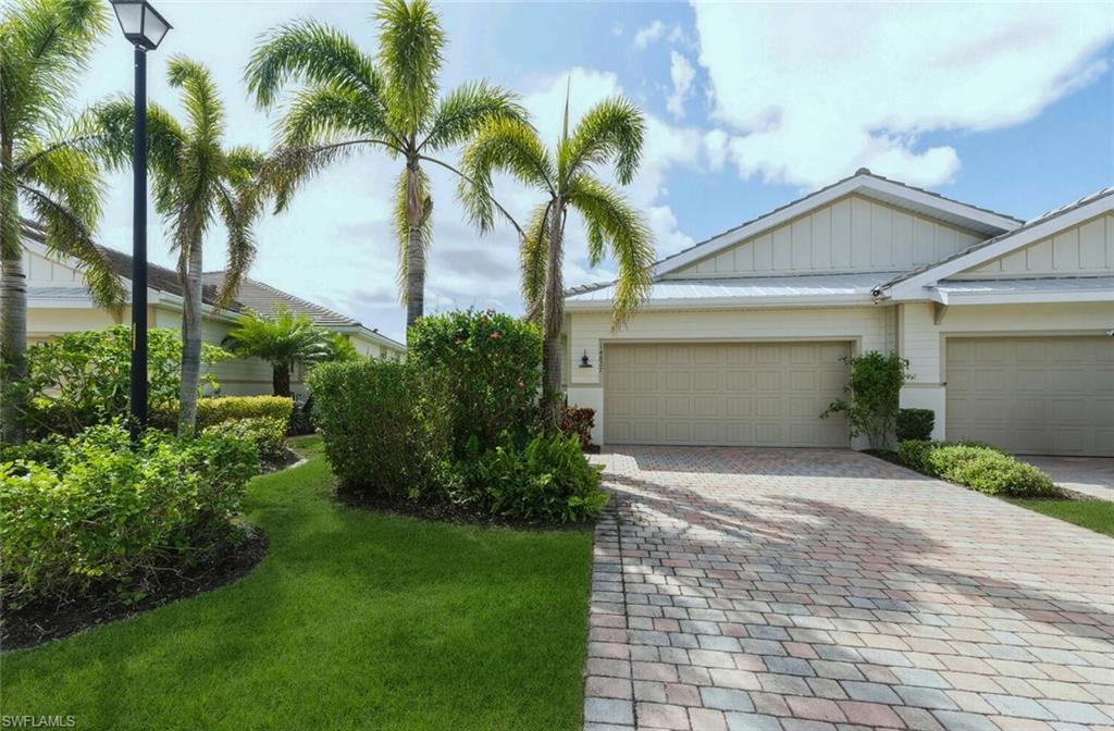 14827 Edgewater Circle Naples, FL 34114 - Photo 3 of 49 a view of house with palm trees