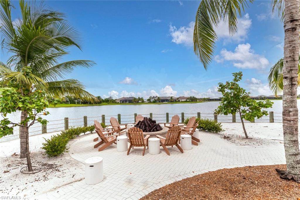 14827 Edgewater Circle Naples, FL 34114 - Photo 39 of 49 a view of a swimming pool with furniture