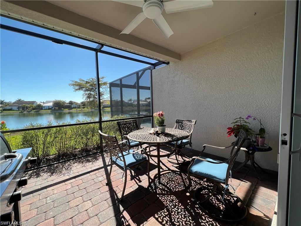 14827 Edgewater Circle Naples, FL 34114 - Photo 6 of 32 a view of a patio with a table chairs and a table