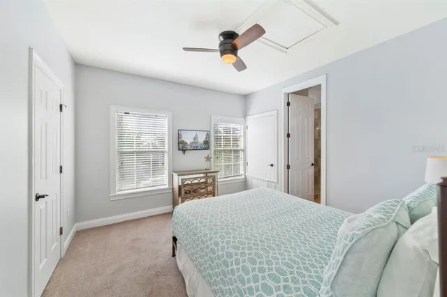 a bed room with a bed and a chandelier