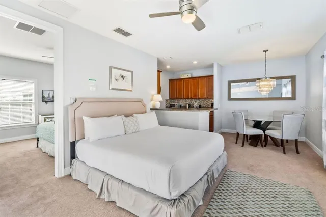 a large white bed in a white room