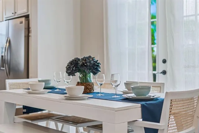a dining room with table and chairs