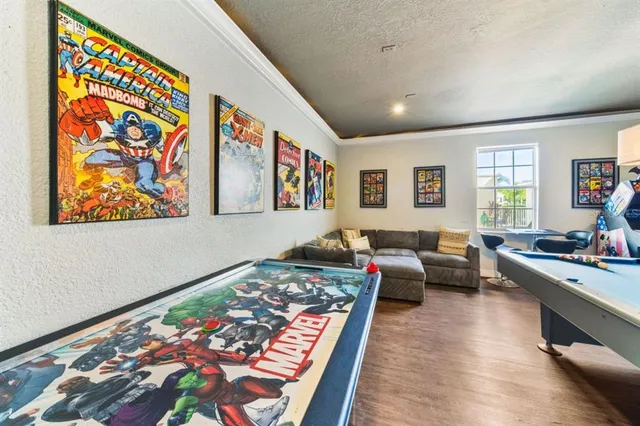 a living room with furniture and painting on the wall