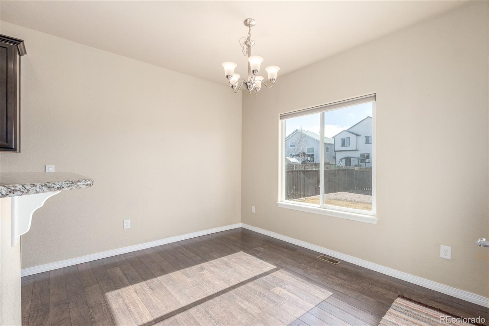 6654 12th Street Frederick, CO 80530 - Photo 11 of 50 a view of an empty room with a window