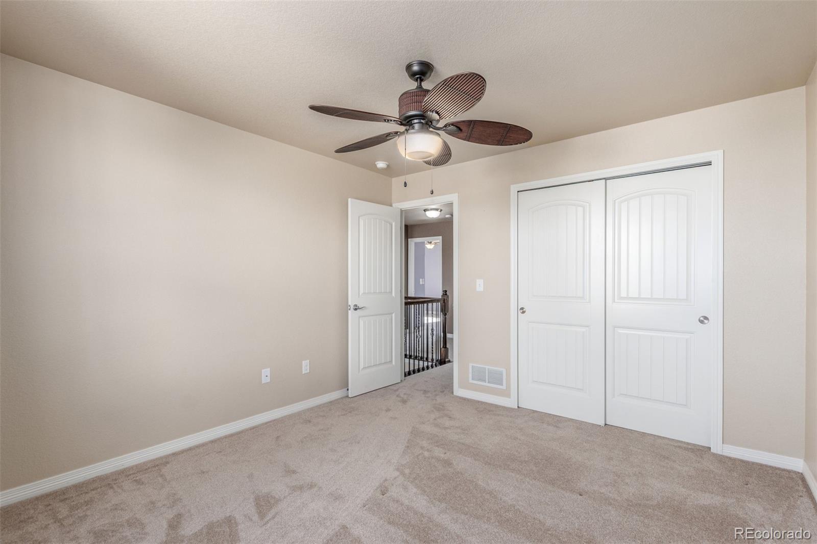 6654 12th Street Frederick, CO 80530 - Photo 32 of 50 a view of an empty room and a ceiling fan