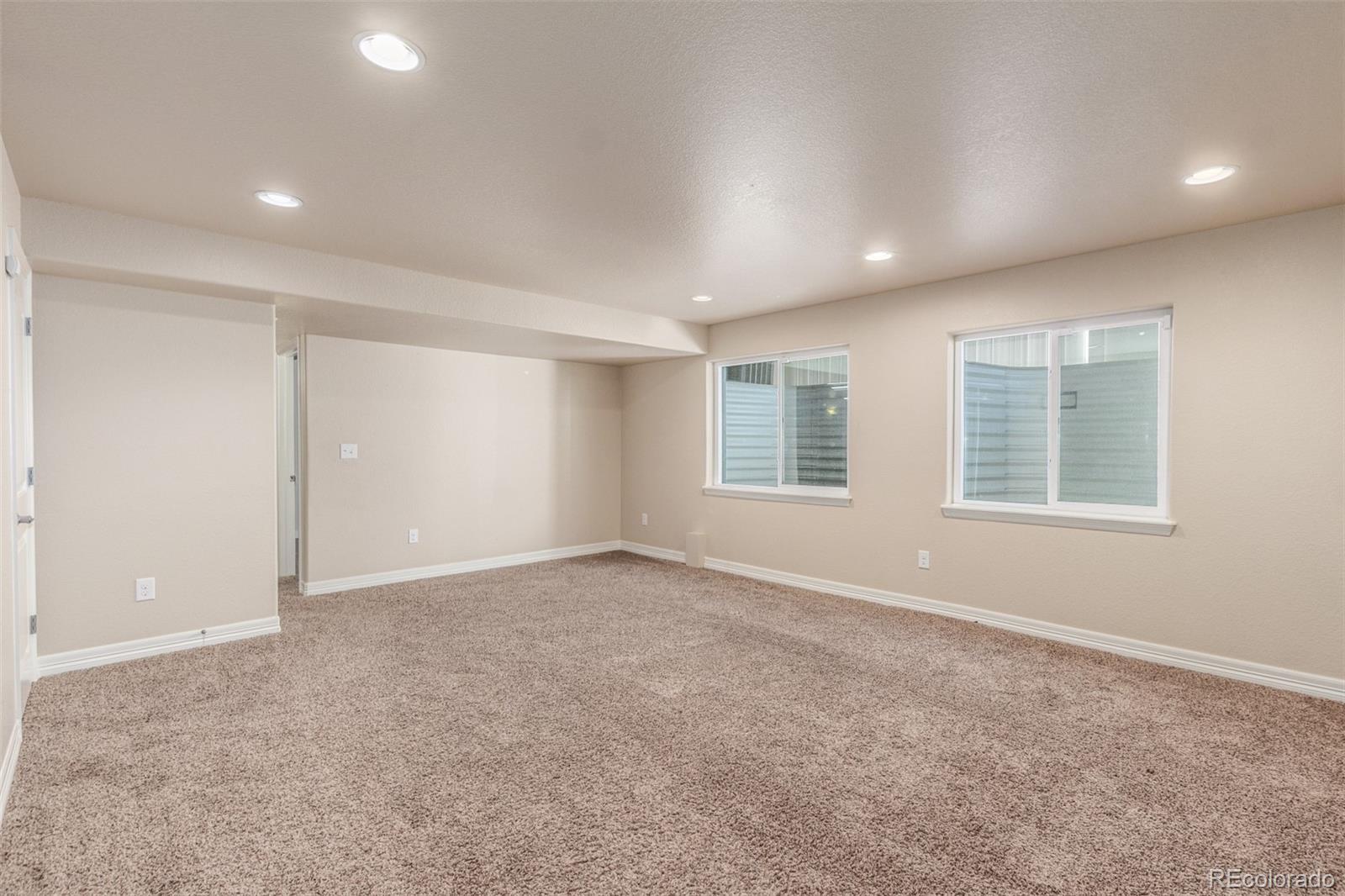 6654 12th Street Frederick, CO 80530 - Photo 33 of 50 an empty room with windows