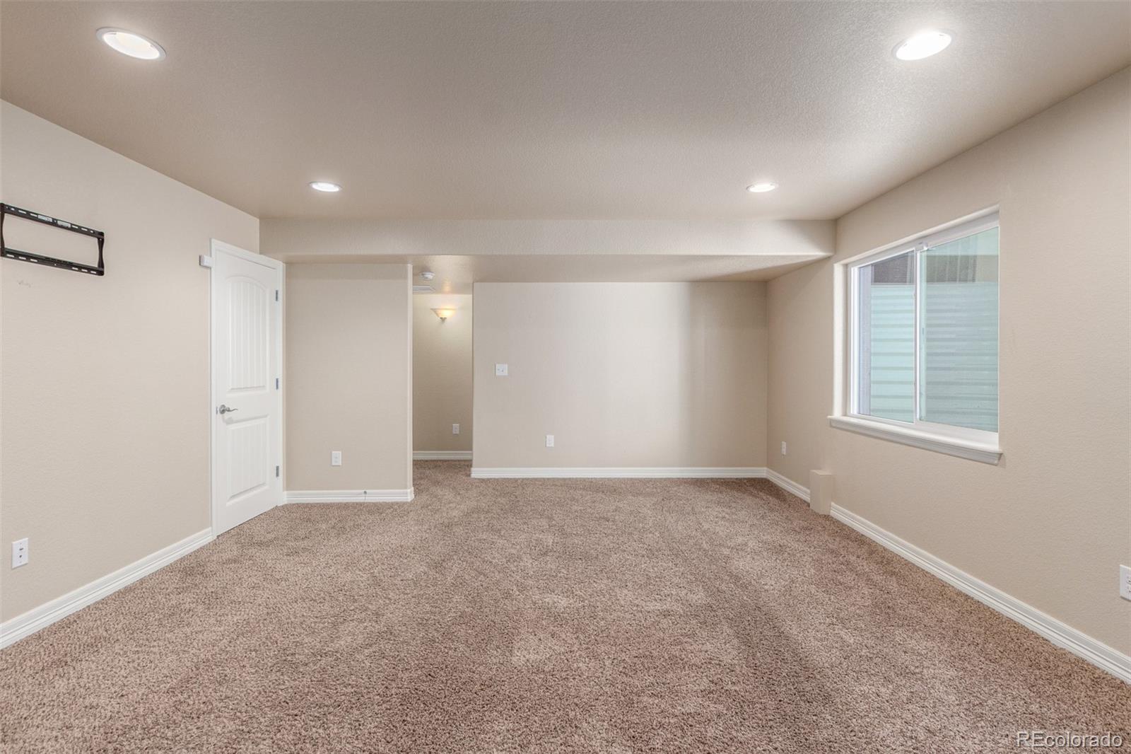 6654 12th Street Frederick, CO 80530 - Photo 34 of 50 a view of an empty room with a window