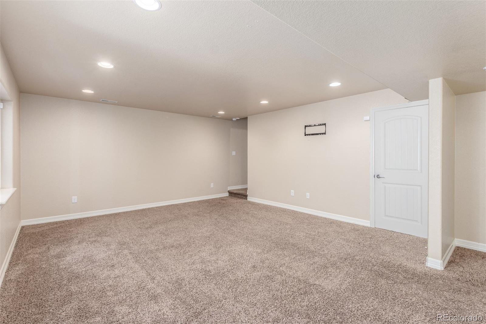 6654 12th Street Frederick, CO 80530 - Photo 35 of 50 an empty room with an entryway