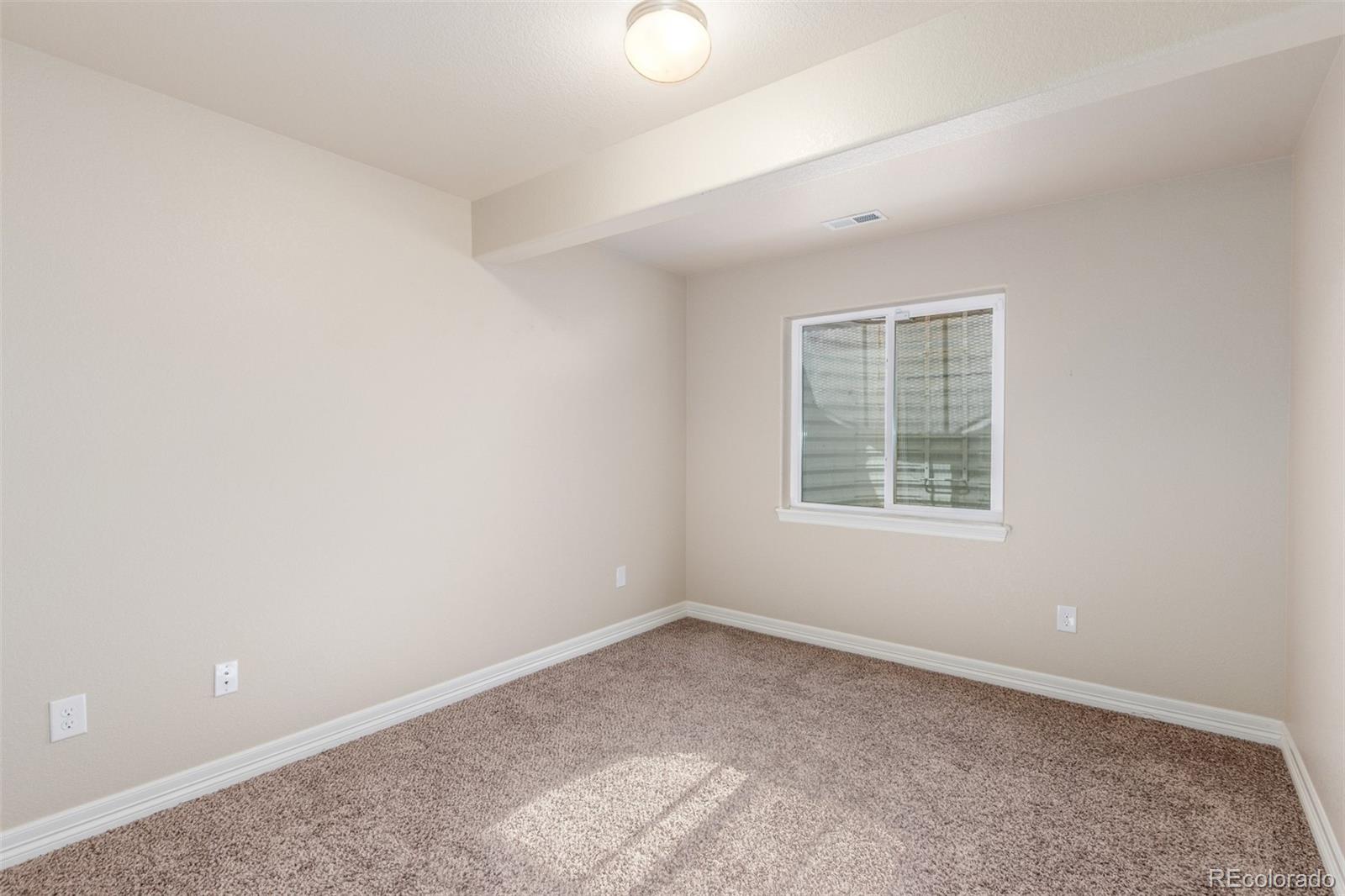 6654 12th Street Frederick, CO 80530 - Photo 37 of 50 an empty room with a window