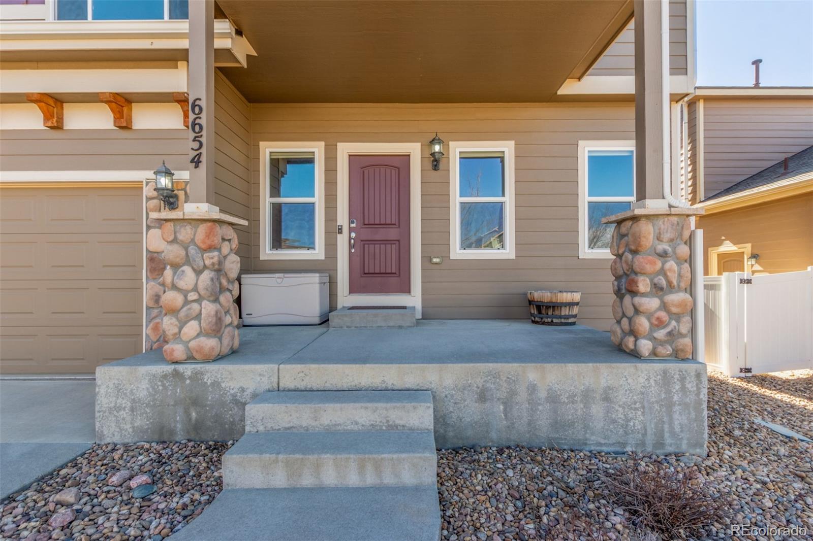 6654 12th Street Frederick, CO 80530 - Photo 4 of 50 a view of house with couch