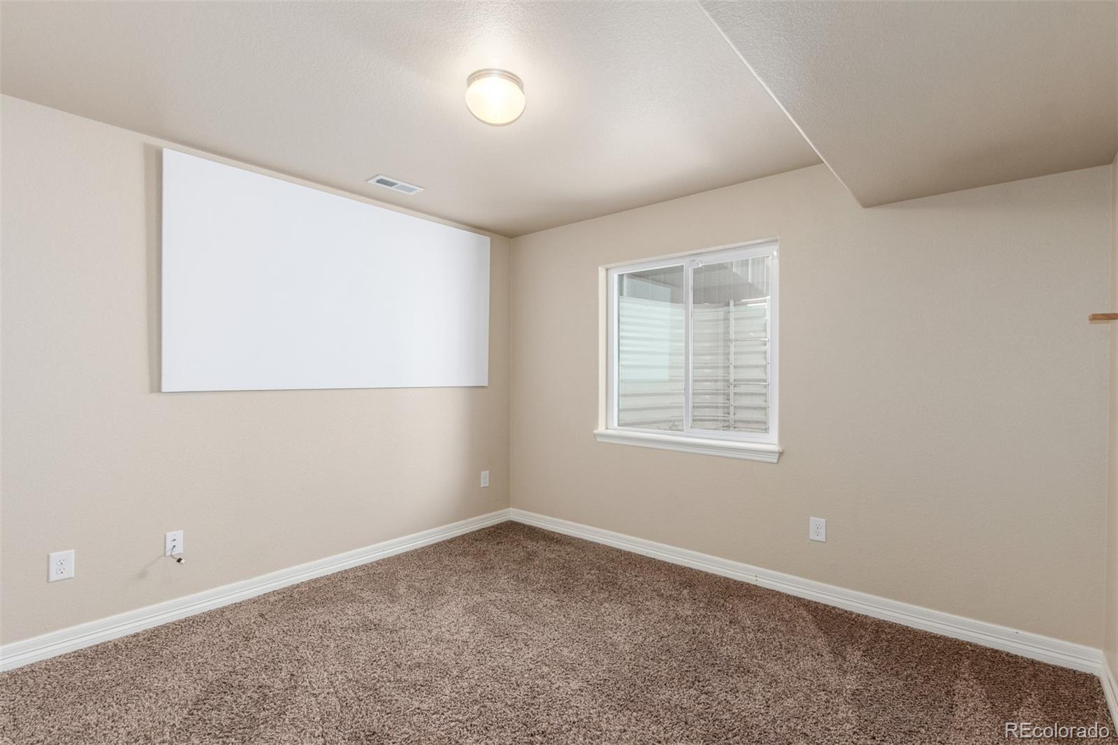 6654 12th Street Frederick, CO 80530 - Photo 41 of 50 an empty room with a window