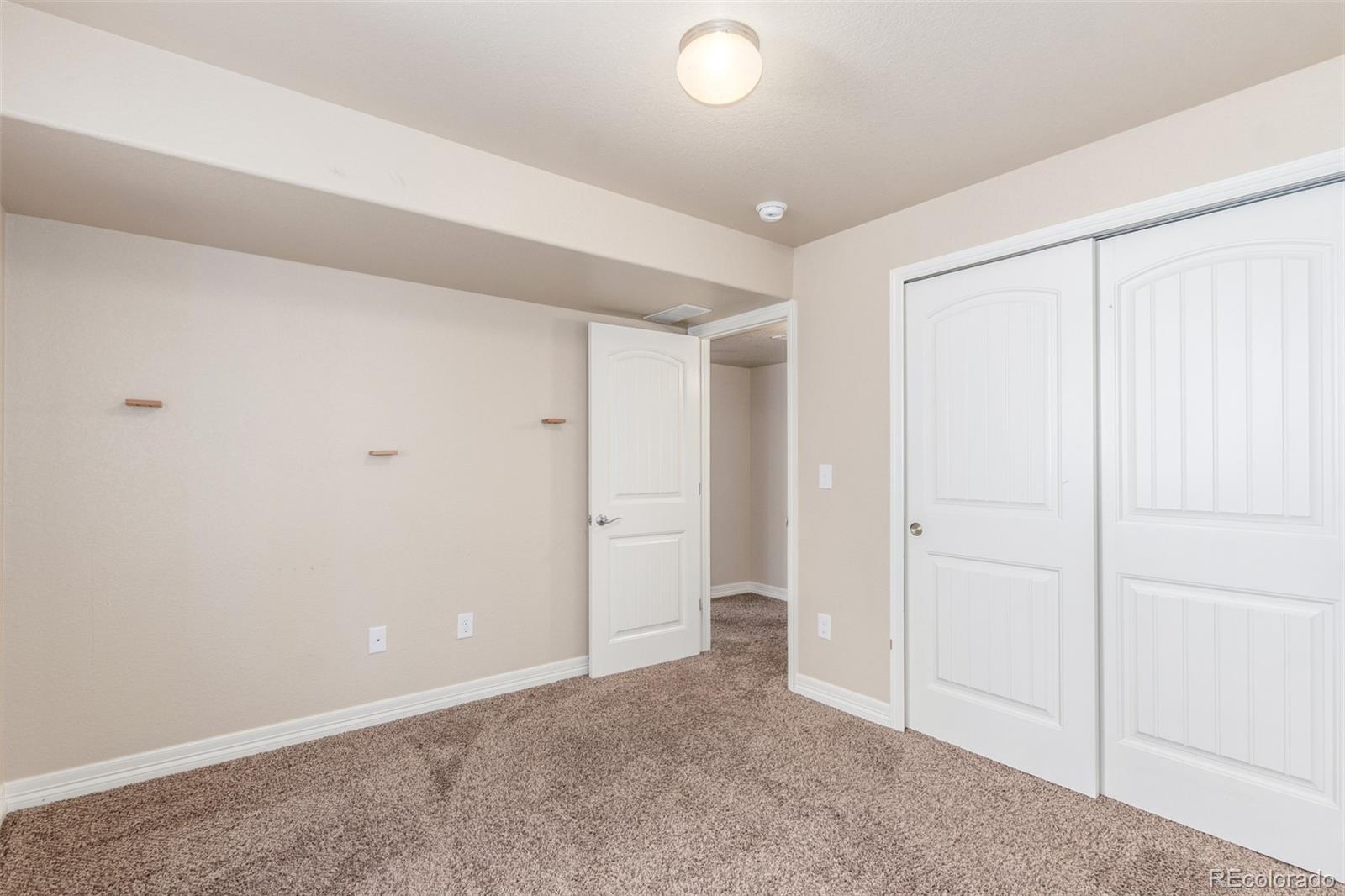 6654 12th Street Frederick, CO 80530 - Photo 43 of 50 an empty room with closet area