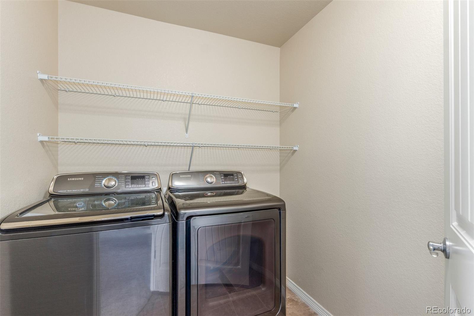 6654 12th Street Frederick, CO 80530 - Photo 44 of 50 a utility room with dryer and washer