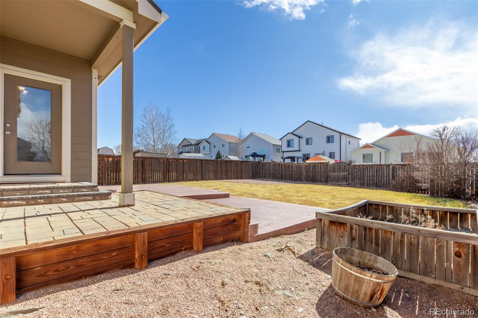 6654 12th Street Frederick, CO 80530 - Photo 45 of 50 a view of a house with swimming pool and sitting area